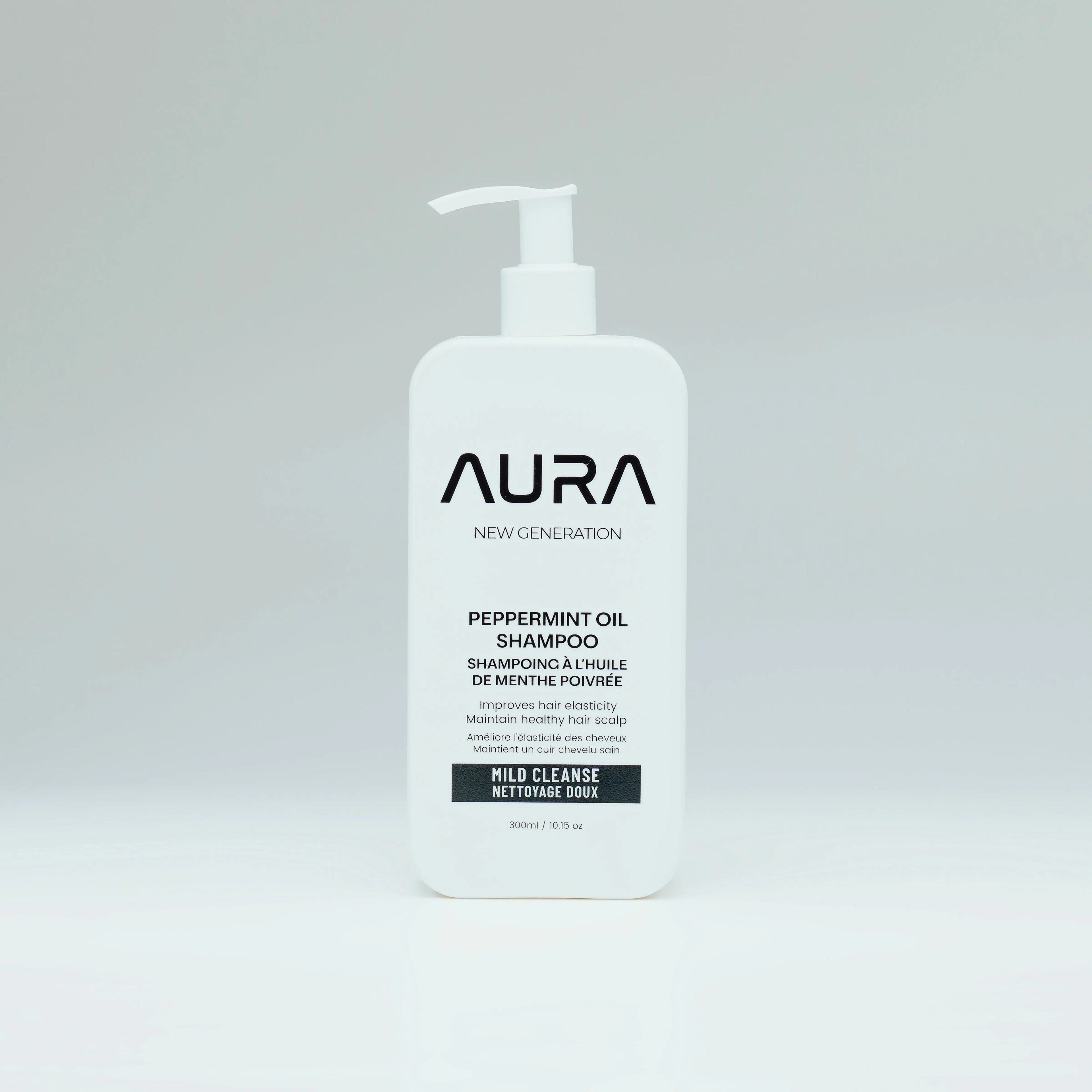 Aura shampoo bottle on a gray background