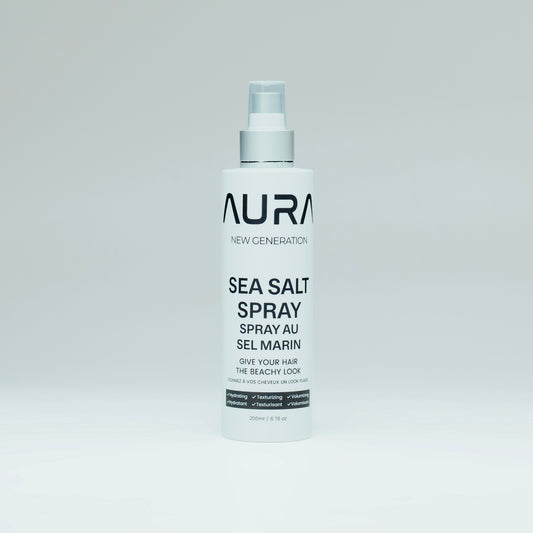 Bottle of Aura Sea Salt Spray on a light gray background