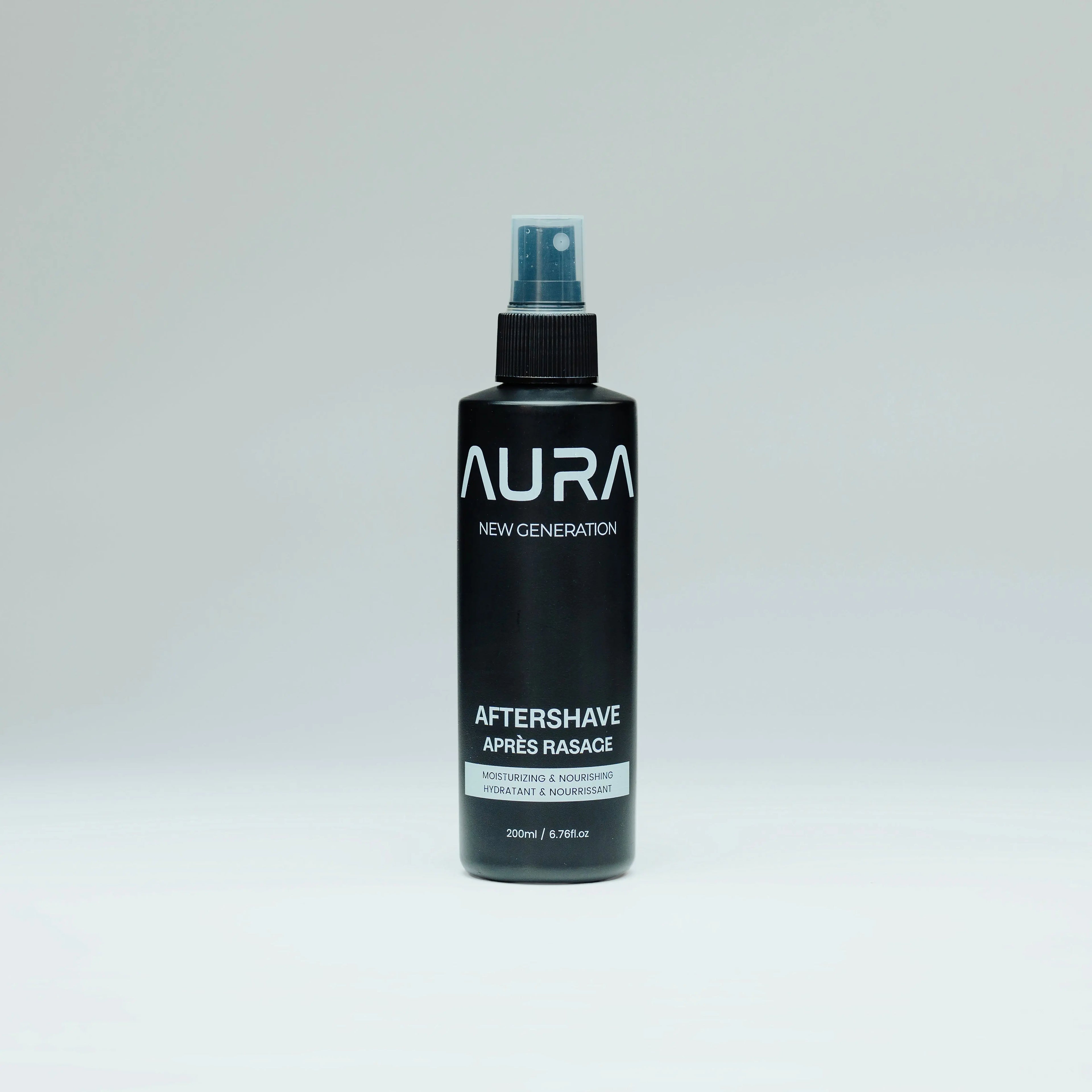 Black bottle of Aura New Generation aftershave on a light gray background
